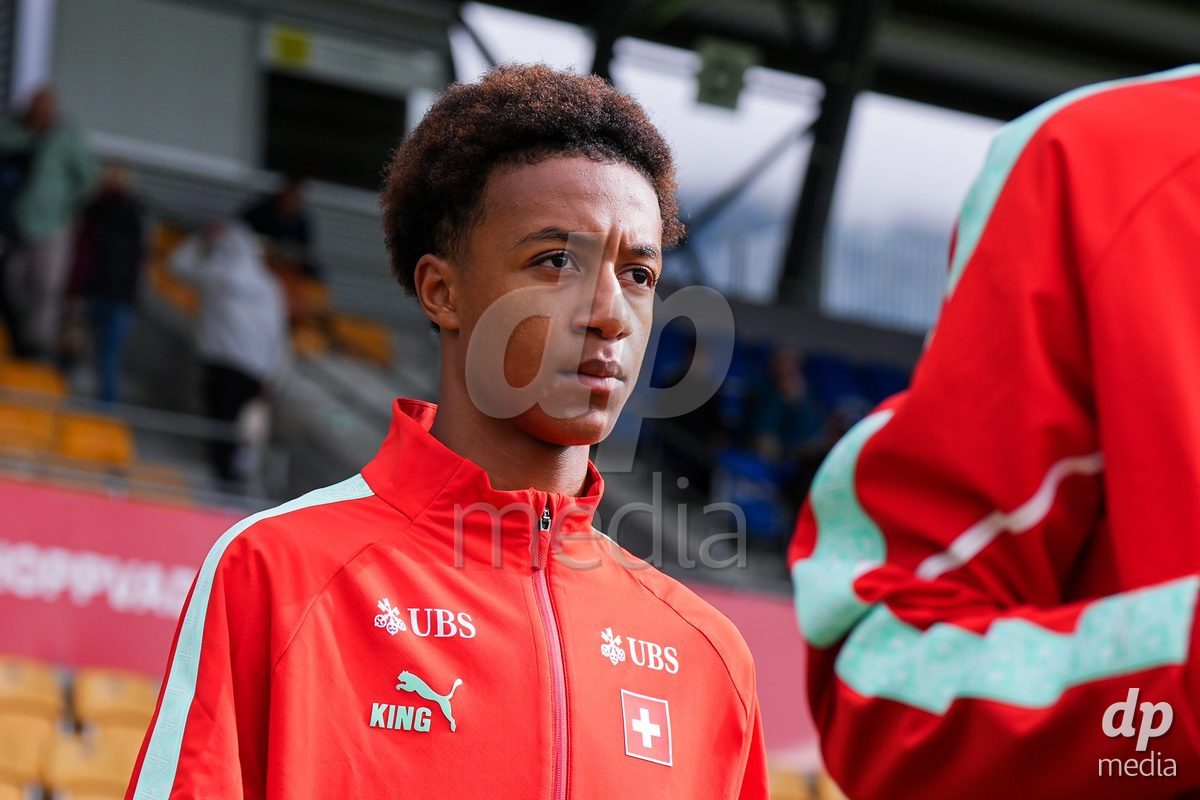 VADUZ, LIECHTENSTEIN - OCTOBER 18: Ryan Hare of Switzerland enters for the natioanl anthem prior to the UEFA European Under-17 Qualifier match between Switzerland and Spain at Rheinpark Stadion on October 18, 2026 in Vaduz, Liechtenstein.