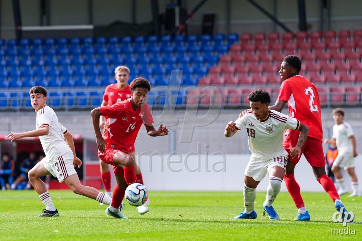 VADUZ, LIECHTENSTEIN - OCTOBER 18: Ryan Hare of Switzerland battles for the ball during the UEFA European Under-17 Qualifier match between Switzerland and Spain at Rheinpark Stadion on October 18, 2026 in Vaduz, Liechtenstein.