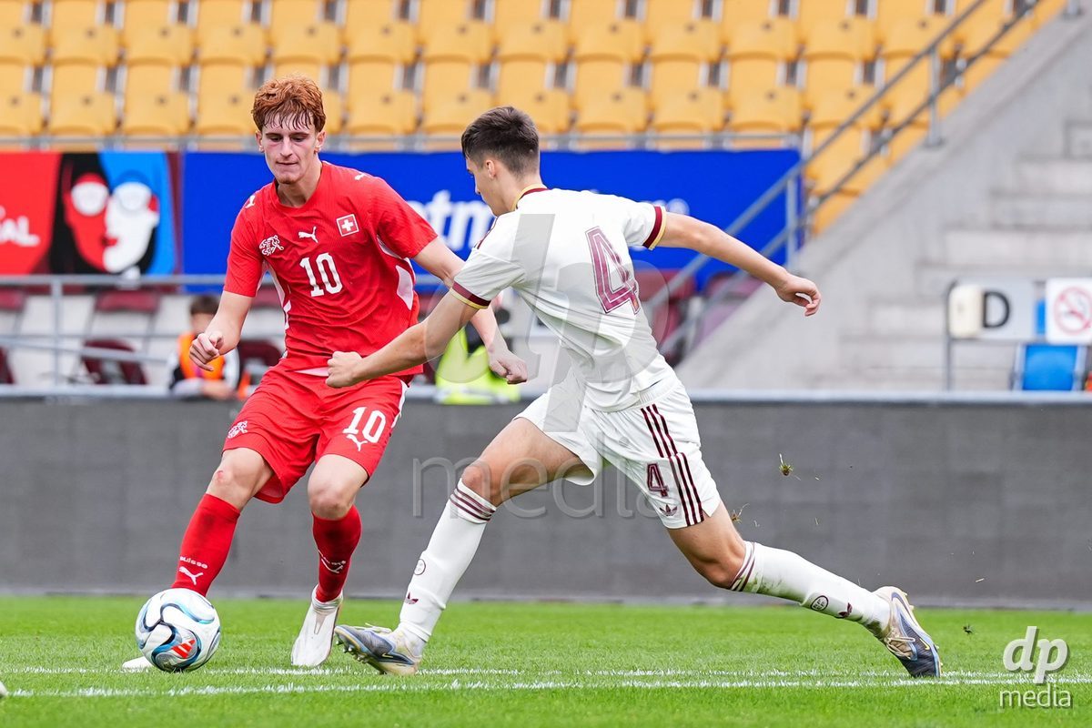 VADUZ, LIECHTENSTEIN - OCTOBER 18: Eron Kele of Switzerland (L) and Kemen Mitxelena of Spain (R) battle for the ball  during the UEFA European Under-17 Qualifier match between Switzerland and Spain at Rheinpark Stadion on October 18, 2026 in Vaduz, Liechtenstein.