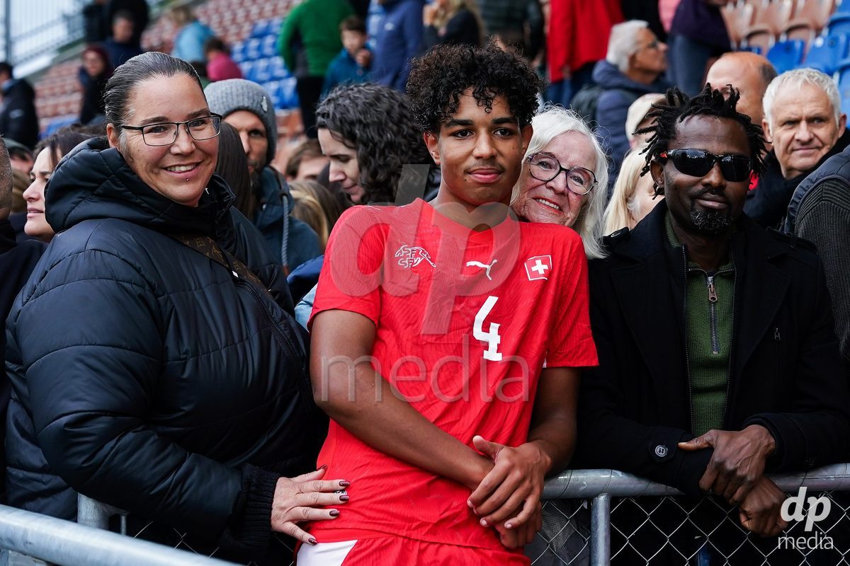 VADUZ, LIECHTENSTEIN - OCTOBER 18: Ifeanyichukwu Onwuzulike of Switzerland with family and friends after the victory during the UEFA European Under-17 Qualifier match between Switzerland and Spain at Rheinpark Stadion on October 18, 2026 in Vaduz, Liechtenstein.