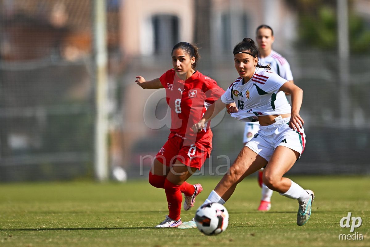 OLIVA NOVA, SPAIN - OCTOBER 24: Ilaria Nerea Maddaloni of Switzerland competes for the ball with Virag Sipos-Kiss of Hungary during the International Women's Friendly match between Switzerland U17 and Hungary U17 at Oliva Nova Sports Center on October 24, 2026 in Oliva Nova, Spain.