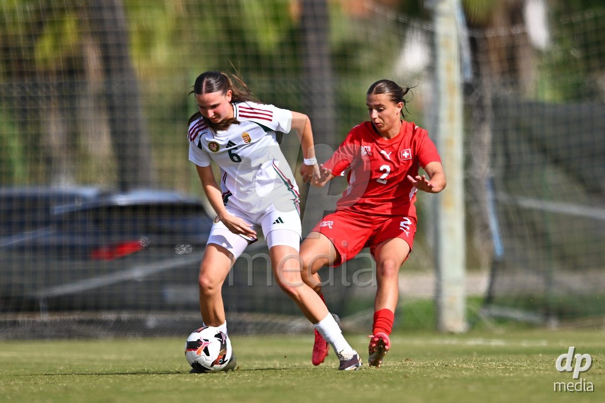 OLIVA NOVA, SPAIN - OCTOBER 24: Boglarka Tramontini of Hungary competes for the ball with Bigna Godenzi of Switzerland during the International Women's Friendly match between Switzerland U17 and Hungary U17 at Oliva Nova Sports Center on October 24, 2026 in Oliva Nova, Spain.