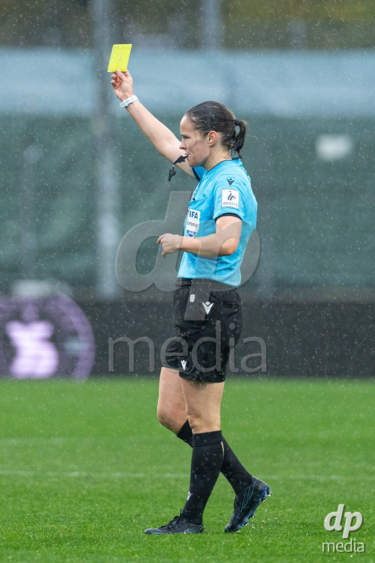 YVERDON-LES-BAINS, SWITZERLAND - OCTOBER 18: Referee Deborah Anex gives a yellow card during the AXA Women's Super League match between FC Yverdon Women and FC Rapperswil-Jona at Stade Municipal on October 18, 2026 in Yverdon-les-Bains, Switzerland.