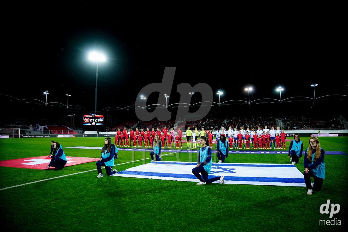 SION, SWITZERLAND - OCTOBER 13: Players of Switzerland and Players of Israel during the national anthems during the FIFA Women´s World Cup European Qualifiers match between Switzerland and Israel at Stade de Tourbillon on October 13, 2026 in Sion, Switzerland.