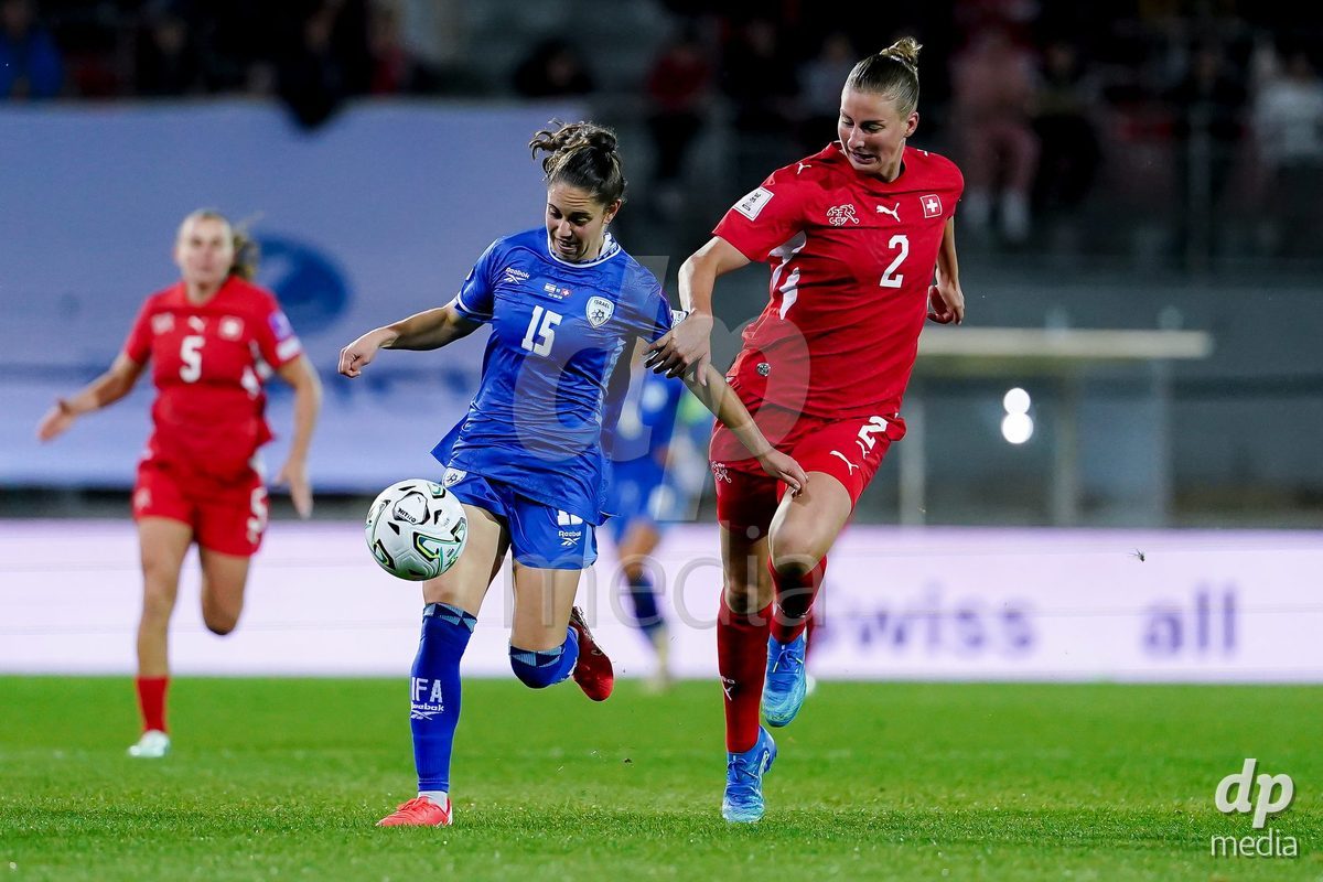 SION, SWITZERLAND - OCTOBER 13: Julia Stierli of Switzerland and Vital Kats of Israel battle for the ball during the FIFA Women´s World Cup European Qualifiers match between Switzerland and Israel at Stade de Tourbillon on October 13, 2026 in Sion, Switzerland.