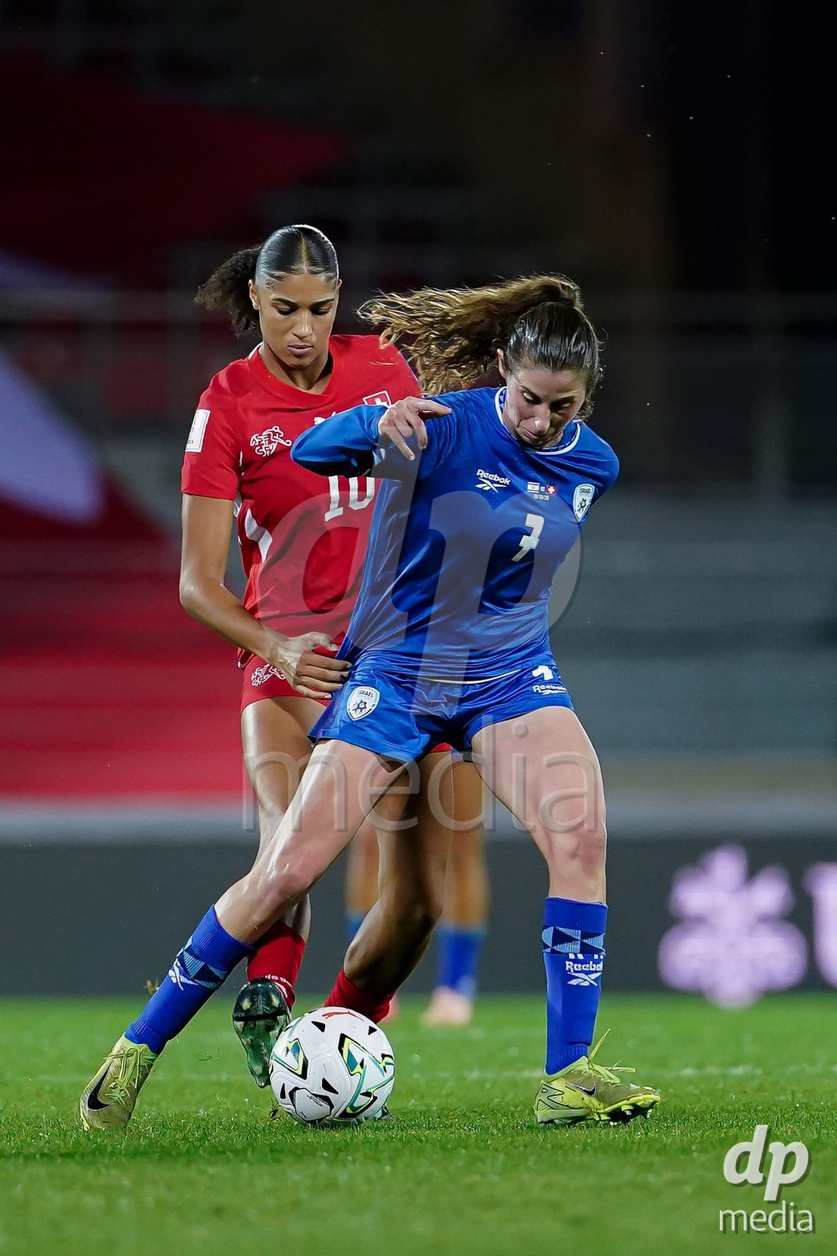 SION, SWITZERLAND - OCTOBER 13: Talia Sommer of Israel and Sydney Schertenleib of Switzerland battle for the ball during the FIFA Women´s World Cup European Qualifiers match between Switzerland and Israel at Stade de Tourbillon on October 13, 2026 in Sion, Switzerland.