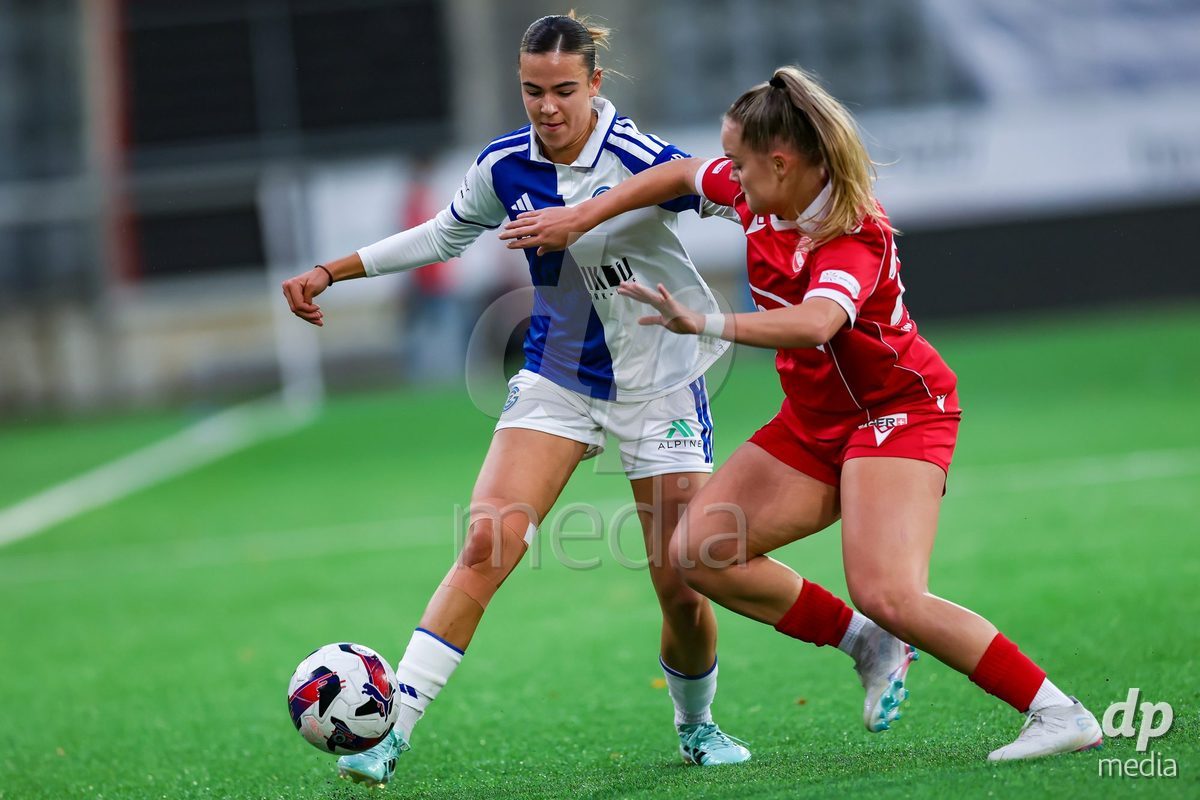THUN, SWITZERLAND - OCTOBER 25: Emma Egli from the GC Frauenfussball (L) challenge for the ball with Rilana Ueltschi from FC Thun Frauen during the AXA Women's Cup match between FC Thun and GC Frauenfussball at Visana Stadion on October 25, 2026 in Thun, Switzerland.