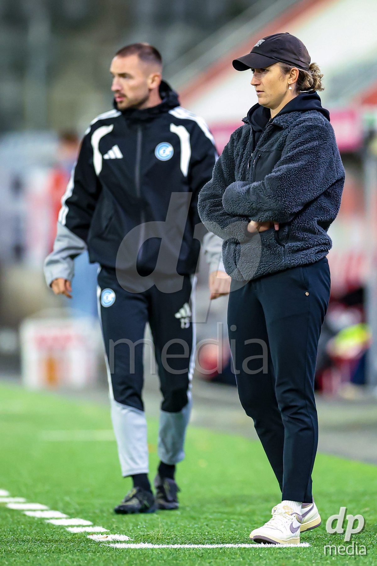THUN, SWITZERLAND - OCTOBER 25: Laura Vetterlein (Head Coach, GC Frauenfussball) (R) during the AXA Women's Cup match between FC Thun and GC Frauenfussball at Visana Stadion on October 25, 2026 in Thun, Switzerland.