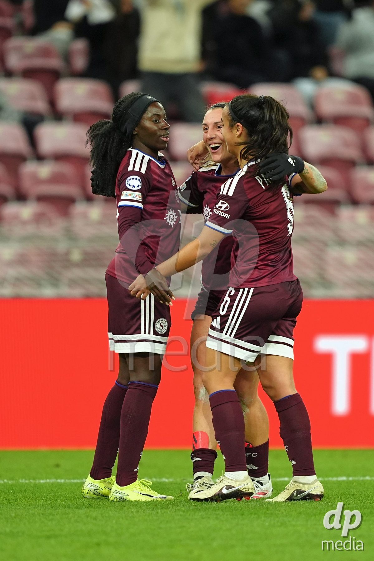 GENEVA, SWITZERLAND - OCTOBER 28: Gloria Marinelli of Servette FC Chenois Feminin celebrates with Paola Hernandez of Servette FC Chenois Feminin and Benedicte Simon of Servette FC Chenois Feminin during the UEFA Women's Champions League match between Servette FC Chenois Feminin and OH Leuven at Stade de Geneve on October 28, 2026 in Geneva, Switzerland.