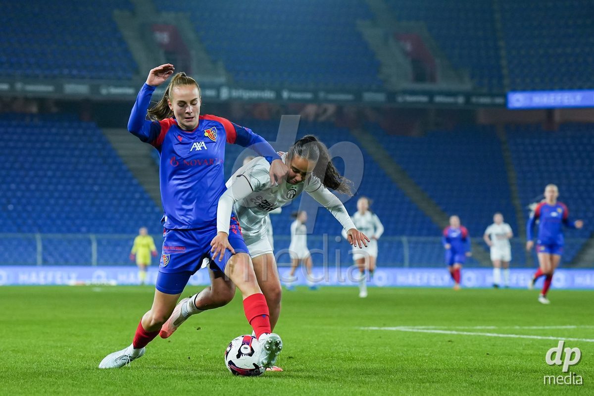 BASEL, SWITZERLAND - OCTOBER 30: Elea Hagmann of FC Basel 1893 (L) and Nevia Stoob of FC Zurich (R) during the AXA Women's Super League match between FC Basel 1893 and FC Zurich at St. Jakob-Park on October 30, 2026 in Basel, Switzerland.