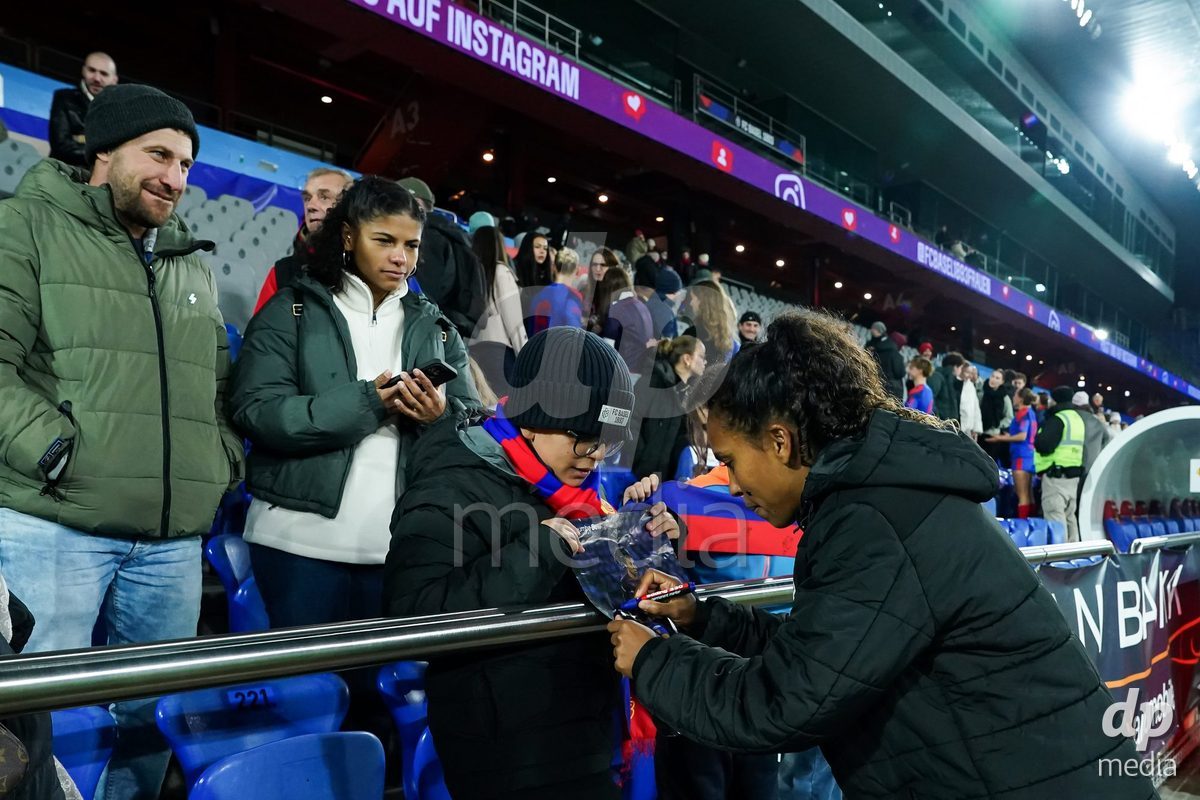 BASEL, SWITZERLAND - OCTOBER 30: Coumba Louisa Sow of FC Basel 1893 signs an autograph after the victory during the AXA Women's Super League match between FC Basel 1893 and FC Zurich at St. Jakob-Park on October 30, 2026 in Basel, Switzerland.