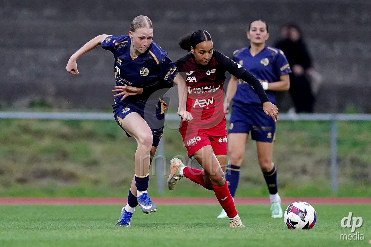 LUZERN, SWITZERLAND - OCTOBER 31: Mara Arnold of FC Luzern and Joy Steck of FC Aarau Frauen battle for the ball during the AXA Women's Super League match between FC Luzern and FC Aarau Frauen at Hubelmatt on October 31, 2026 in Luzern, Switzerland.